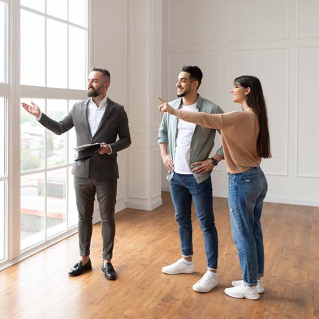 Real Estate Agent Showing Young Buyers New Propert 2021 12 09 20 22 47 Utc1